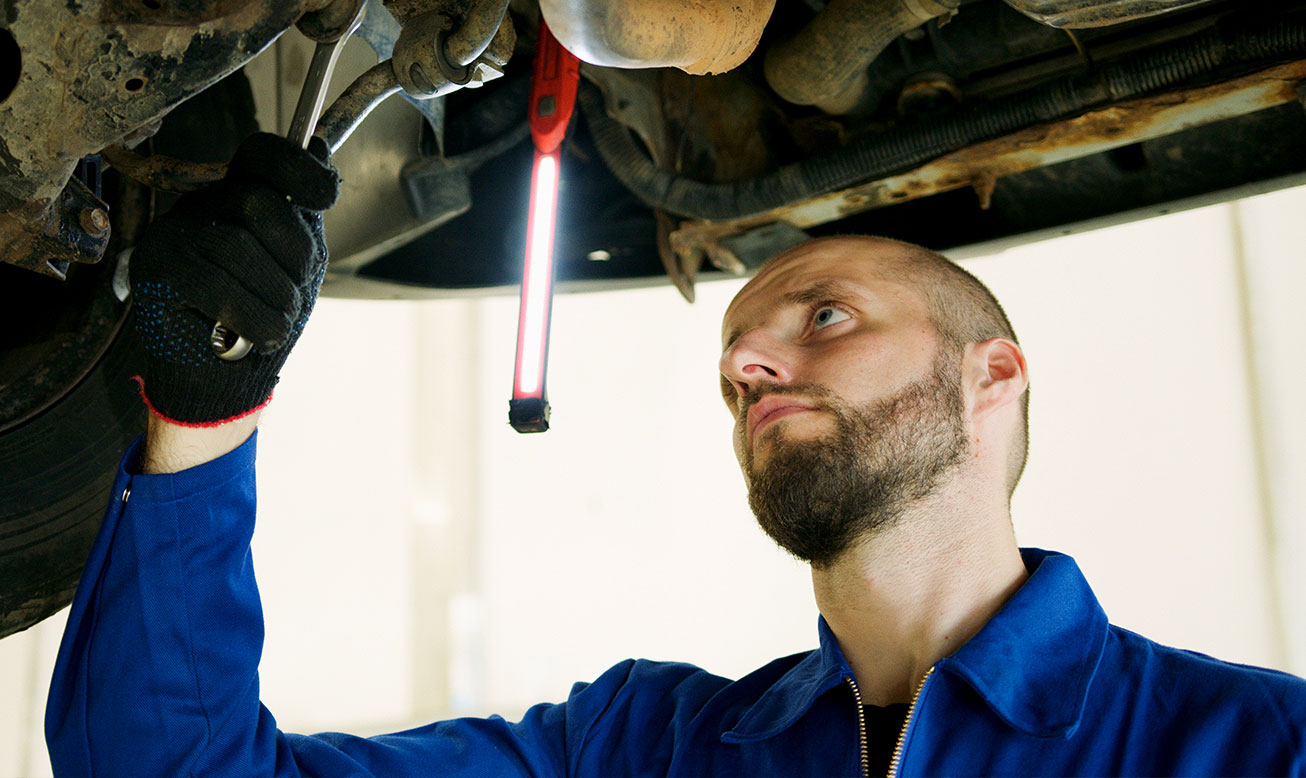 Mechanic Working on Car 1 Mechanic Working on Car 1